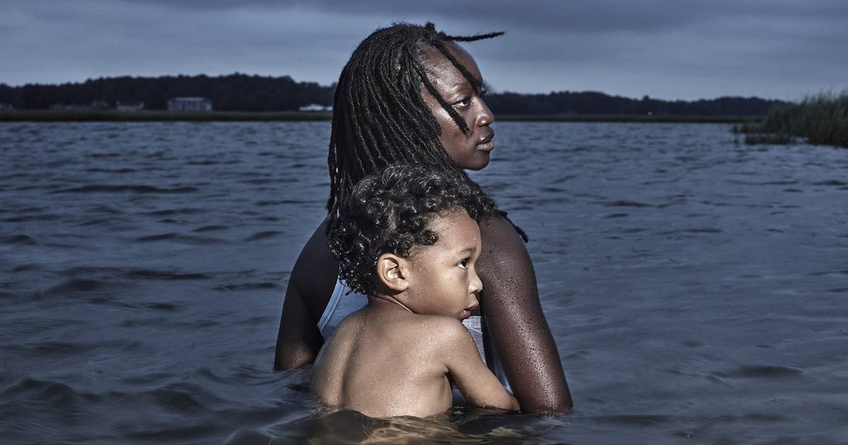The Human Element documentary film black woman with her child in rising water